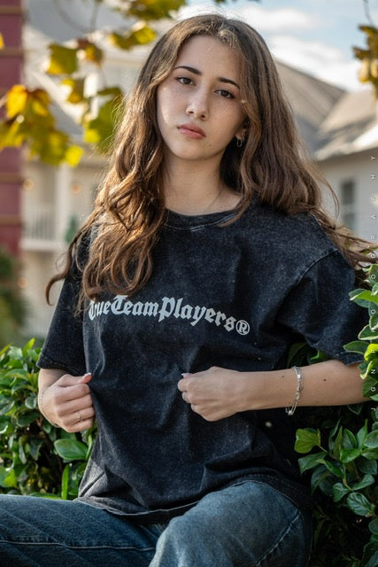 Model wearing the black washed lightweight t-shirt outdoors