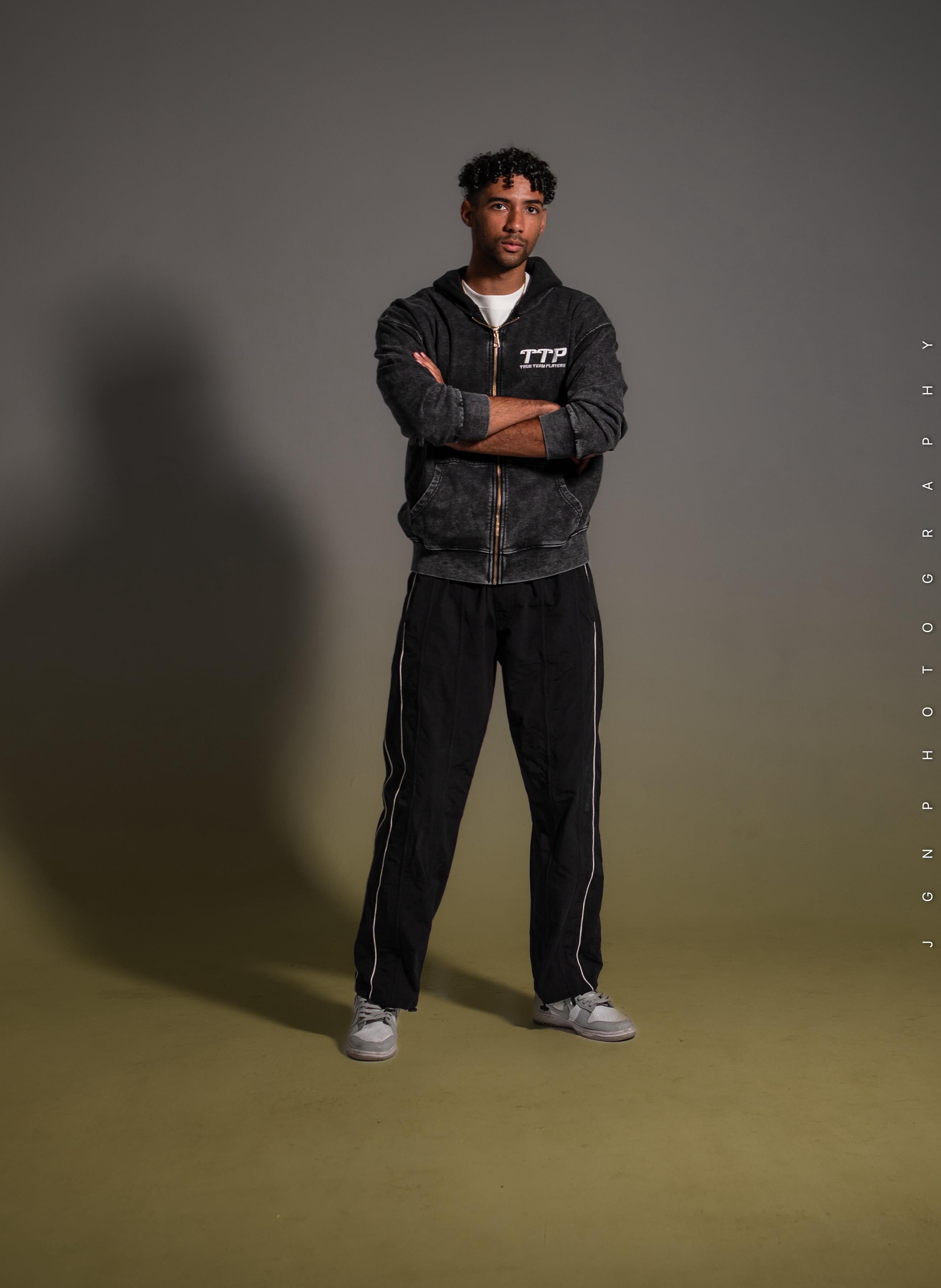 Model wearing the gray TTP oversized zipper hoodie